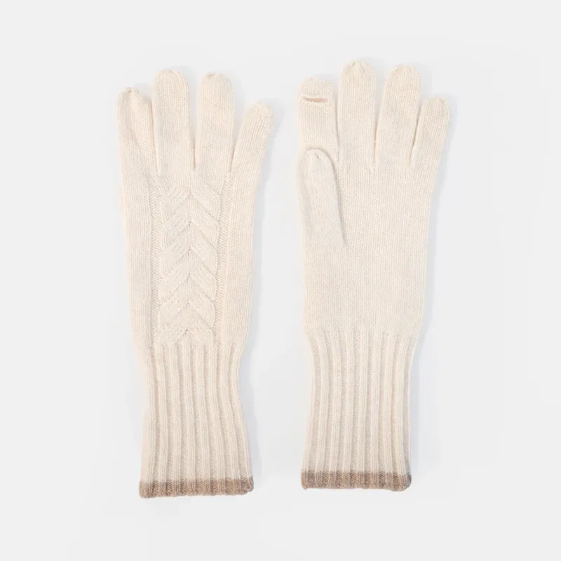 a pair of cream coloured gloves with a cable knit design and ribbed cuff with a taupe colour trim, set against a white background